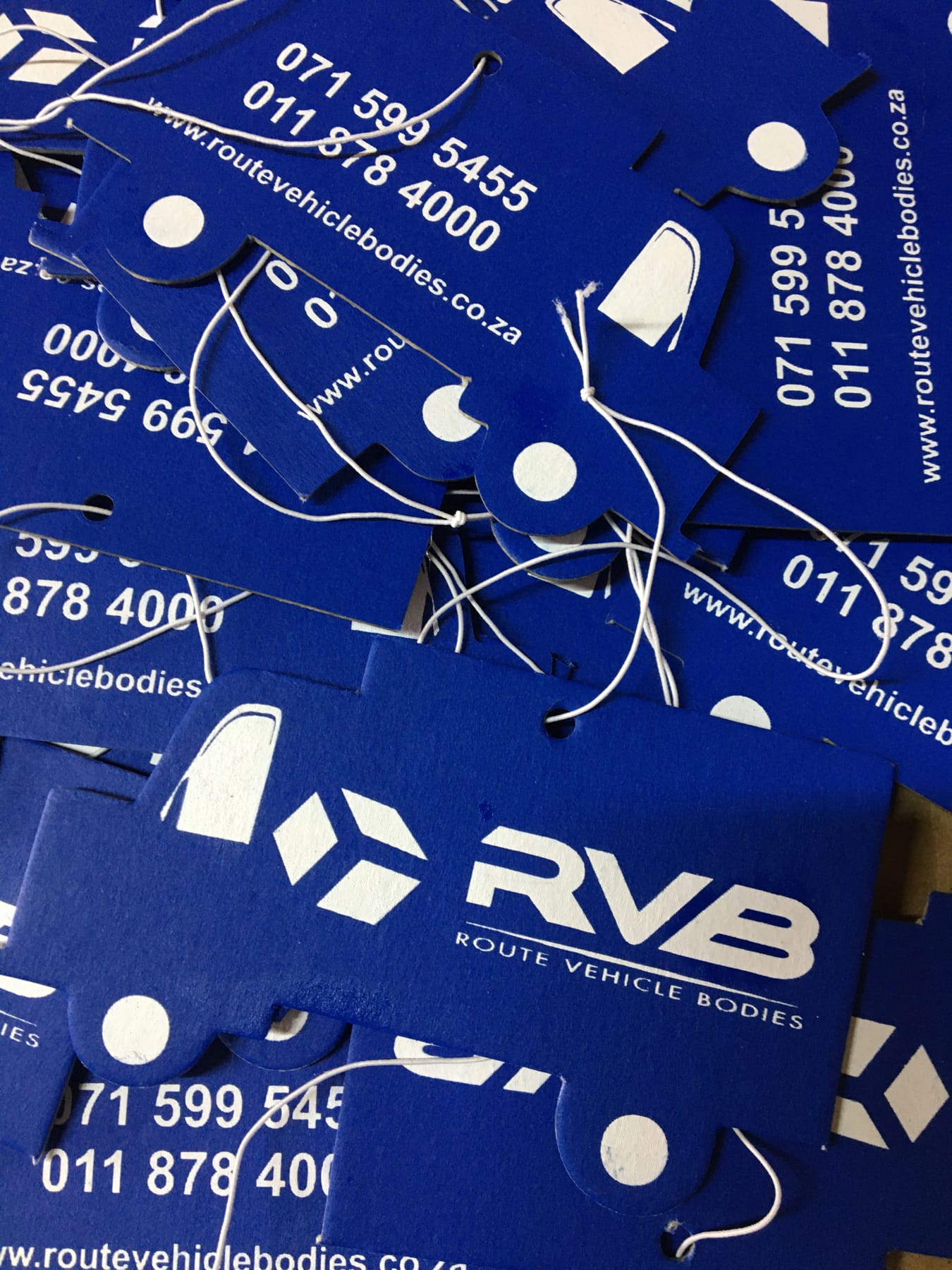 Blue truck shaped promotional air fresheners printed with the RVB logo